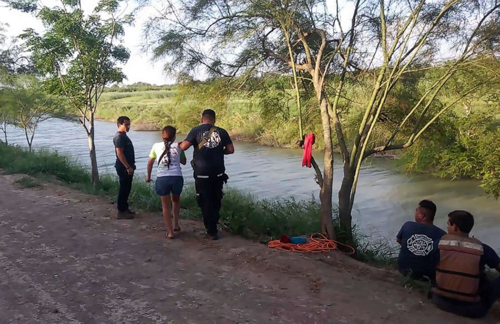 PHOTO: Tania Vanessa A?valos of El Salvador, center left, is assisted by Mexican authorities after her husband and nearly two-year-old daughter drowned trying to cross the Rio Grande to Brownsville, Texas, in Matamoros, Mexico, June 23, 2019.