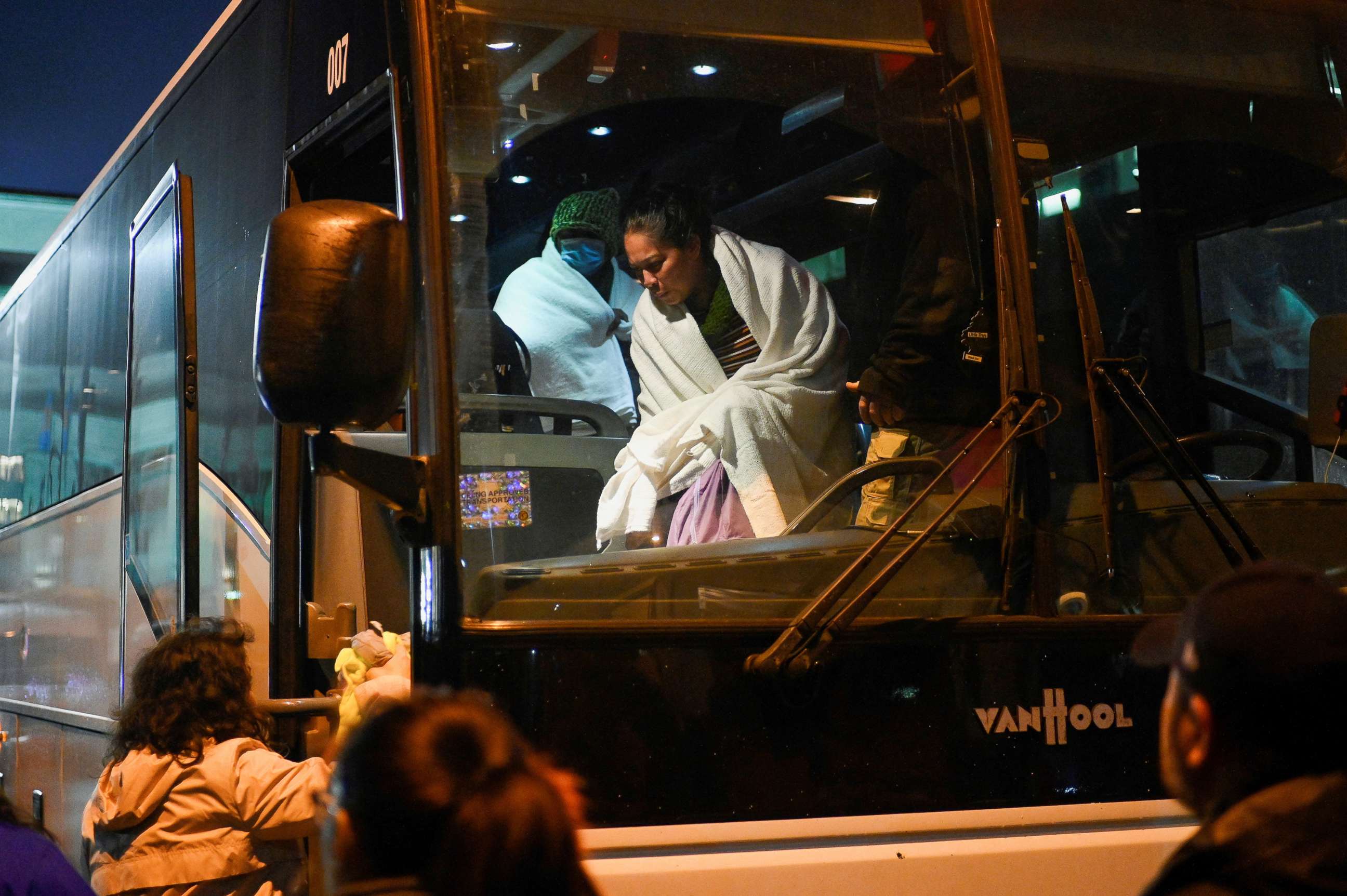PHOTO: Migrants transported from the U.S. border arrive on a bus from Texas and are taken by city officials to wait for relocation, in Philadelphia, Nov. 16, 2022.