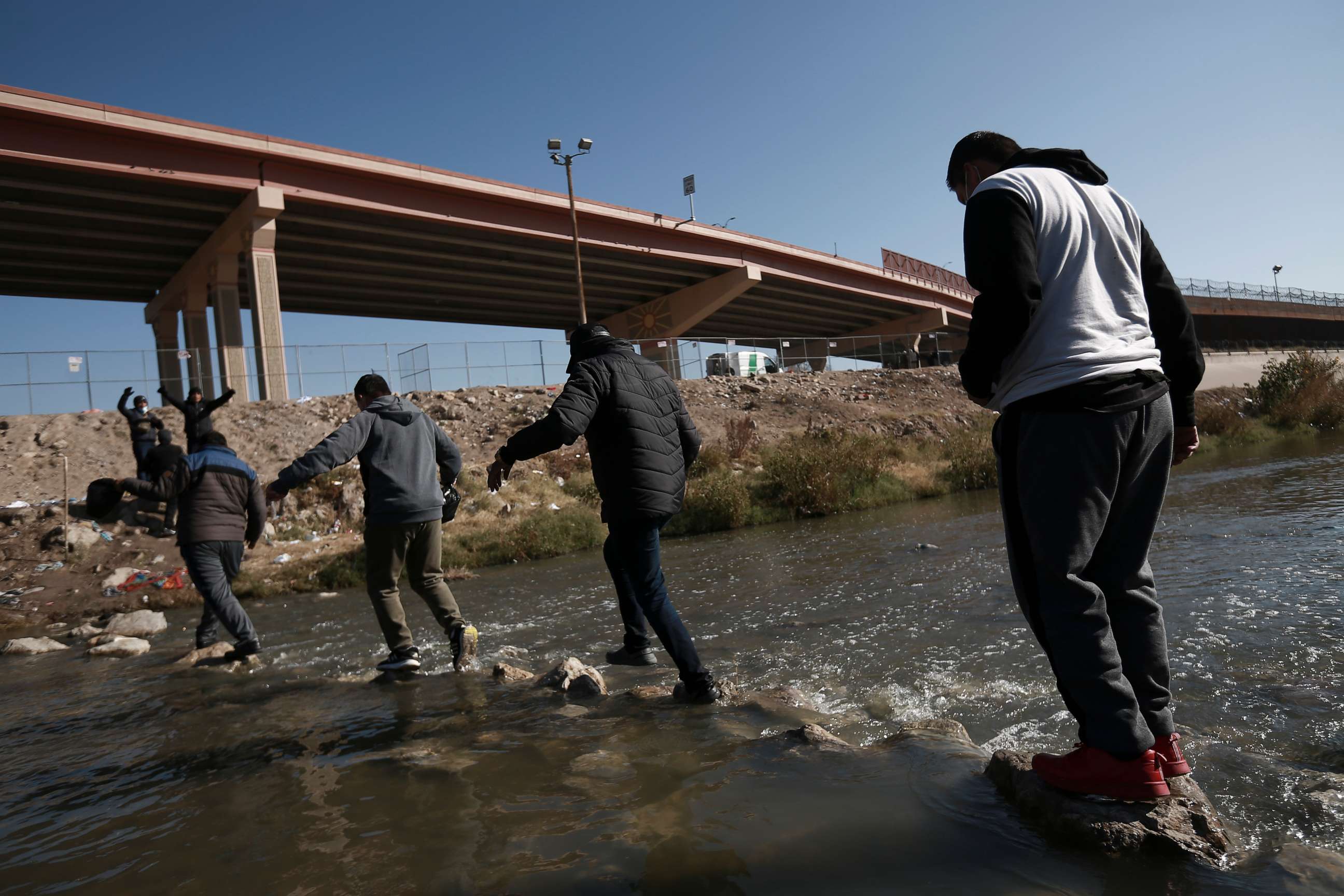 PHOTO: Migrants walk towards the US-Mexico border, Dec. 18, 2022, in Ciudad Juarez, Mexico.