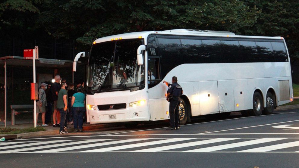 PHOTO: A group of mainly Venezuelan migrants, who were sent by bus from detention in Texas, are dropped off outside the Naval Observatory, the official residence of Vice President Kamala Harris in Washington, Sept. 17, 2022.