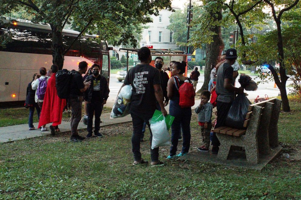 PHOTO: A group of mainly Venezuelan migrants, who were sent by bus from detention in Texas and then dropped off outside the Naval Observatory, the official residence of U.S. Vice President Kamala Harris, wait for transport in Washington, Sept. 17, 2022.