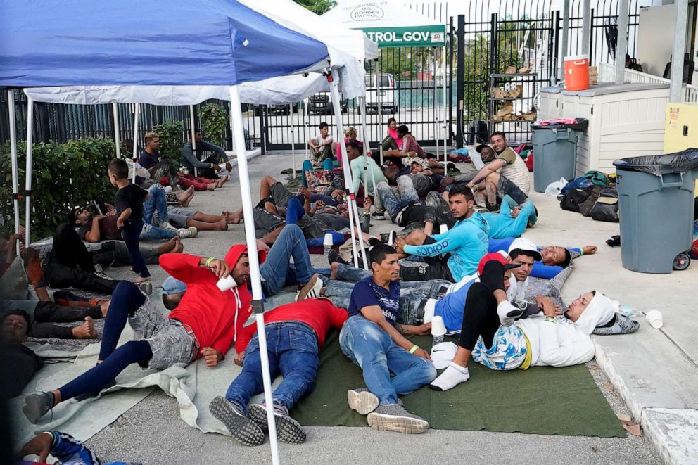 PHOTO: Recently arrived migrants wait in a garage area of the U.S. Customs and Border Protection - Marathon Border Patrol Station, on Jan. 4, 2023, in Marathon, Fla.