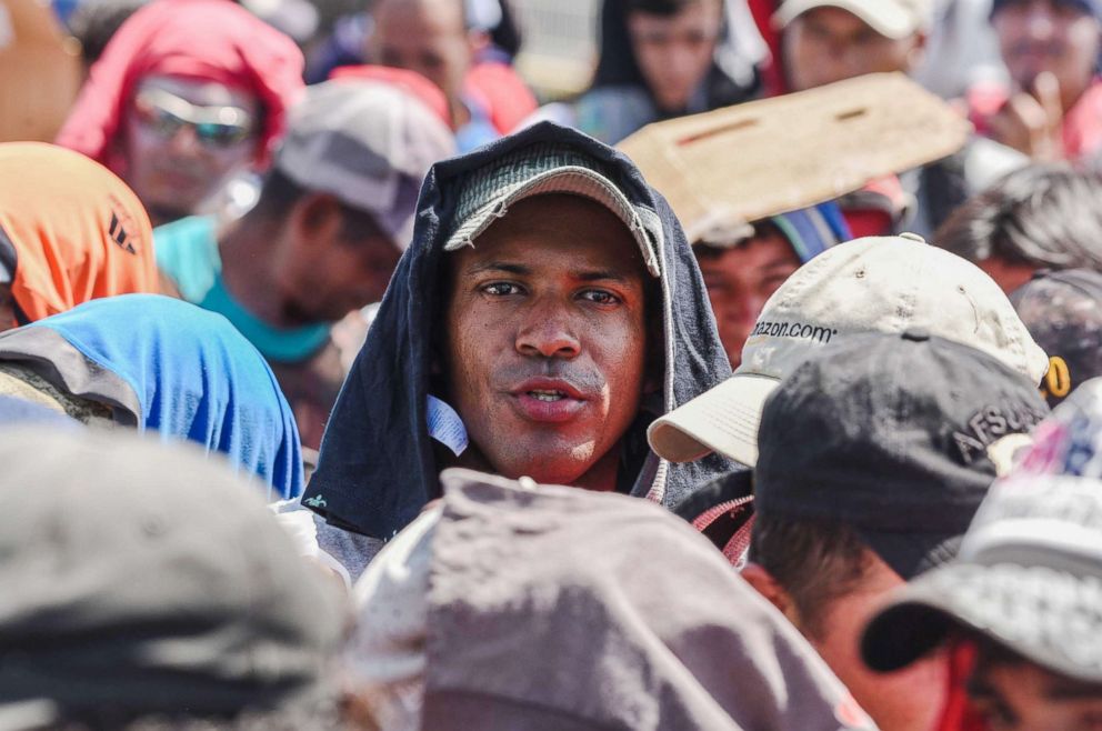 PHOTO: Honduran migrants taking part in a caravan heading to the U.S., wait to cross the border from Ciudad Tecun Uman in Guatemala, to Ciudad Hidalgo, Mexico, Oct. 22, 2018.