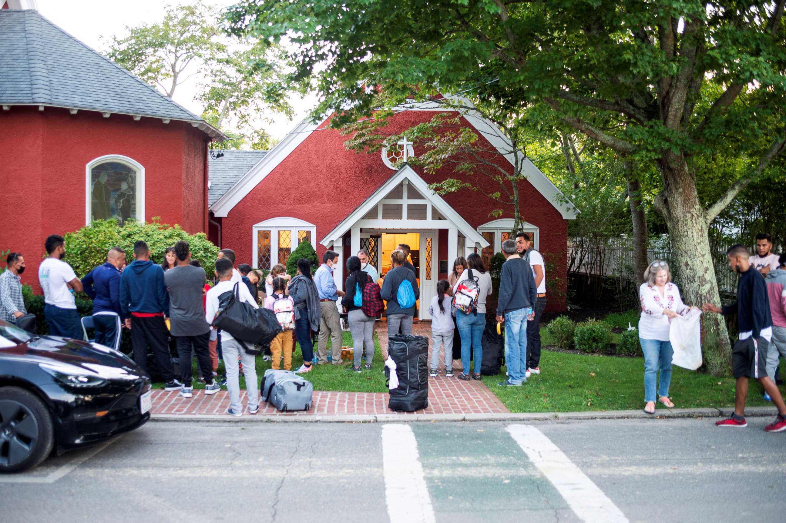 PHOTO: Migrants stand outside St. Andrew's Church in Edgartown, Massachusetts, Sept. 14, 2022.