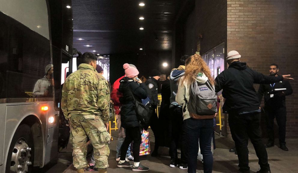 PHOTO: Migrants arriving from Del Rio, Texas, get off a bus at Port Authority in Manhattan, Dec. 19, 2022.