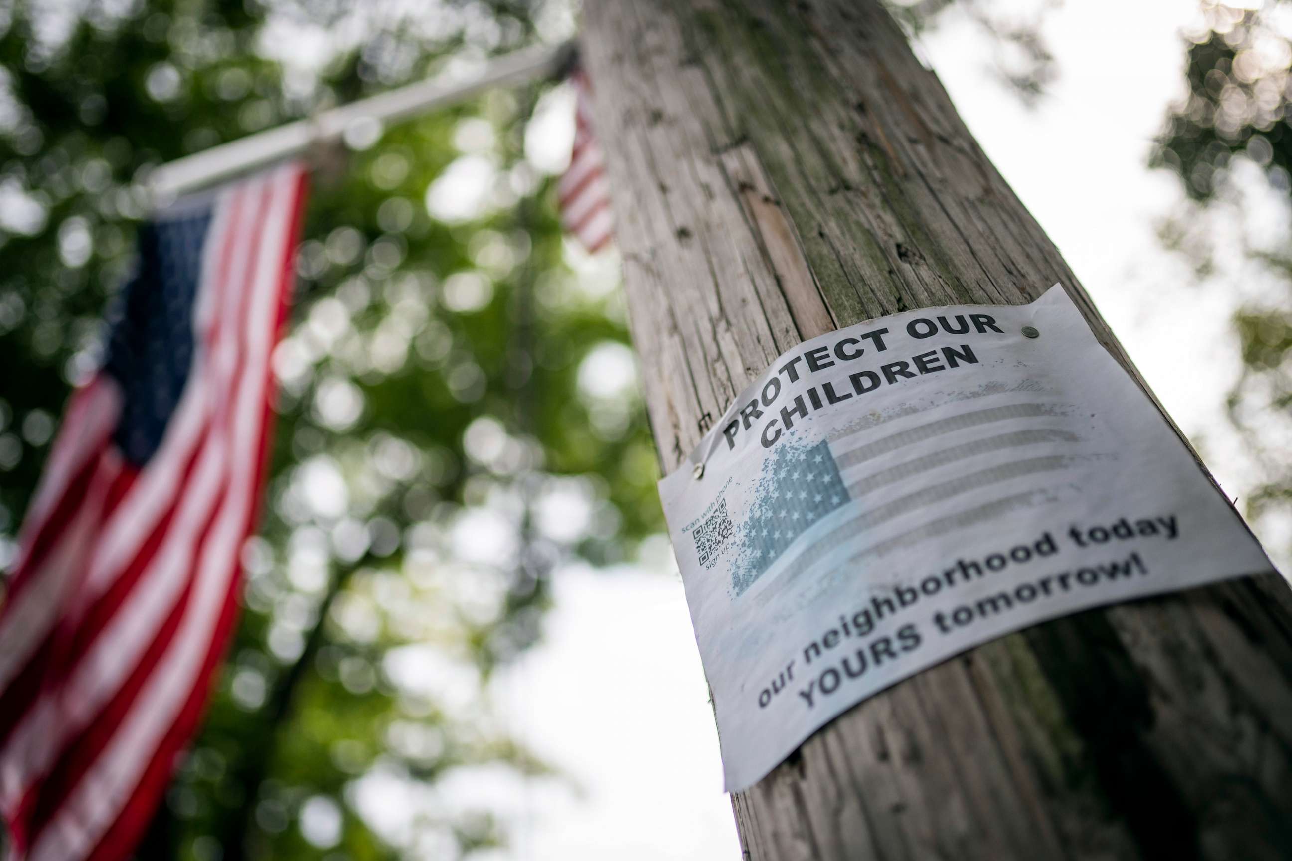 PHOTO: Protest signs are posted outside the former Saint John Villa Academy being repurposed as a shelter for homeless migrants, Wednesday, Sept. 13, 2023, in the Staten Island borough of New York.