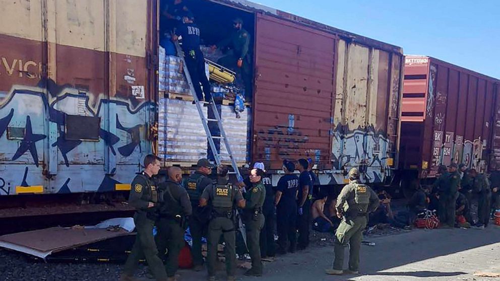 PHOTO: Photo shows officers responding to the scene where one migrant died and three others were hospitalized on Saturday after they and eight others were rescued from a Union Pacific train box car in Eagle Pass, Texas.