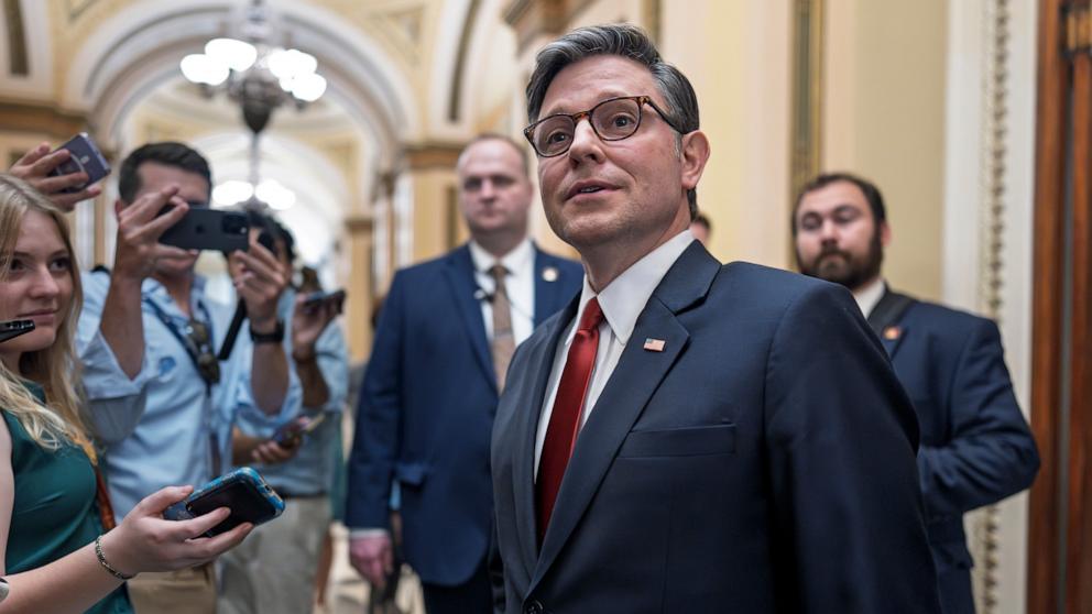 PHOTO: Speaker of the House Mike Johnson pauses to speak to reporters as he enters the chamber and prepares for final passage of President Donald Trump's signature bill of tax breaks and spending cuts, at the Capitol in Washington, July 3, 2025.