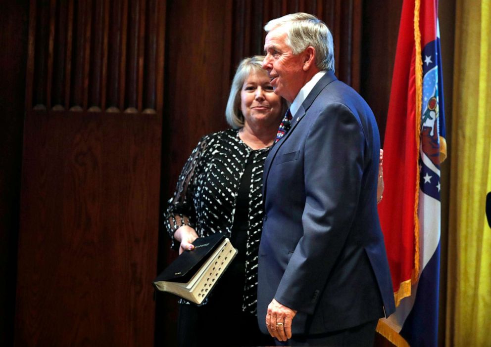 PHOTO: Gov. Mike Parson, right, smiles along side his wife, Teresa, after being sworn in as Missouri's 57th governor in Jefferson City, Mo., June 1, 2018.