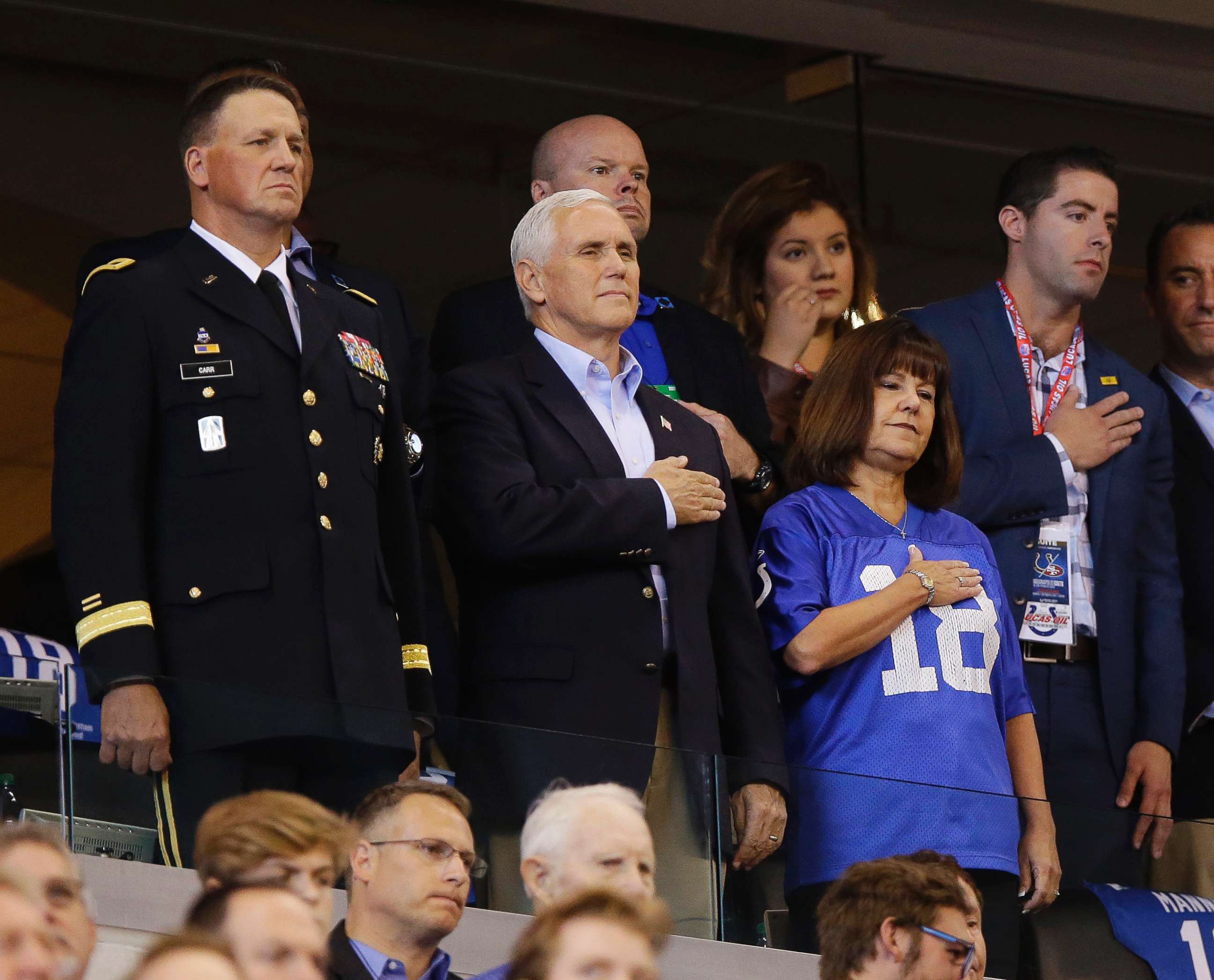 PHOTO: Vice President Mike Pence, front center, stands during the playing of the national anthem before an NFL football game between the Indianapolis Colts and the San Francisco 49ers, Oct. 8, 2017, in Indianapolis. 
