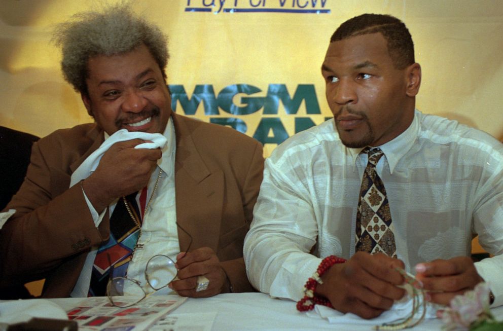 PHOTO: Promoter Don King, left, joins boxer Mike Tyson during a Harlem news conference, June 20, 1995, in New York. Tyson came home to a festive hero's welcome after three years in prison, basking in the cheers of a sweltering crowd.