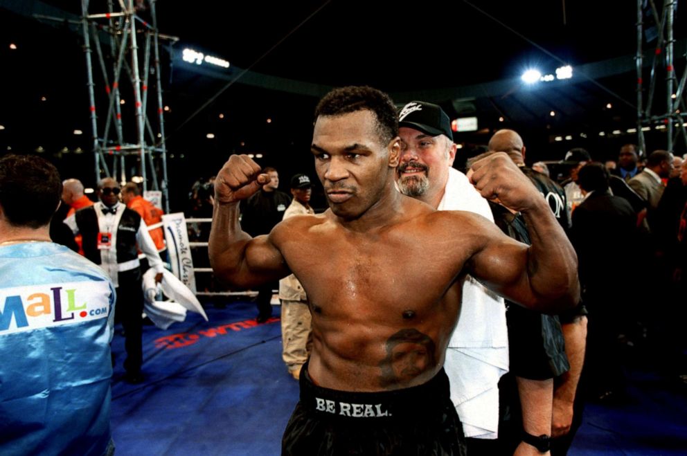 PHOTO: Mike Tyson strikes a traditional pose to celebrate his easy victory over Lou Savarese on June 24, 2000.