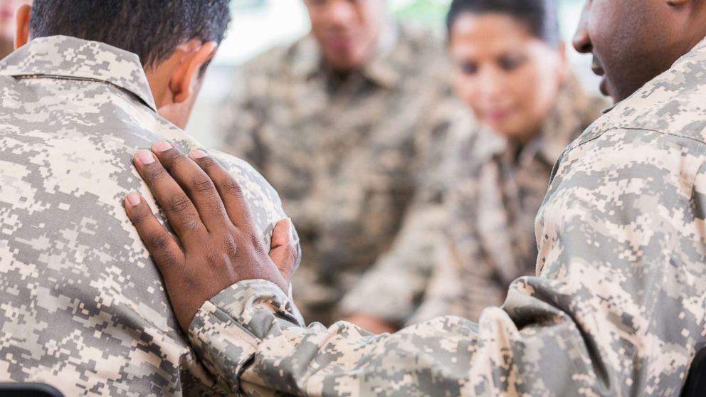 PHOTO: People in military uniform talk during a support group in an undated stock photo.