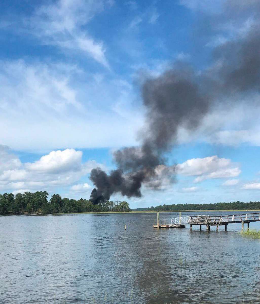 PHOTO: Smoke bellows from a military jet that crashed, Friday, Sept. 28, 2018 in Beaufort, S.C.