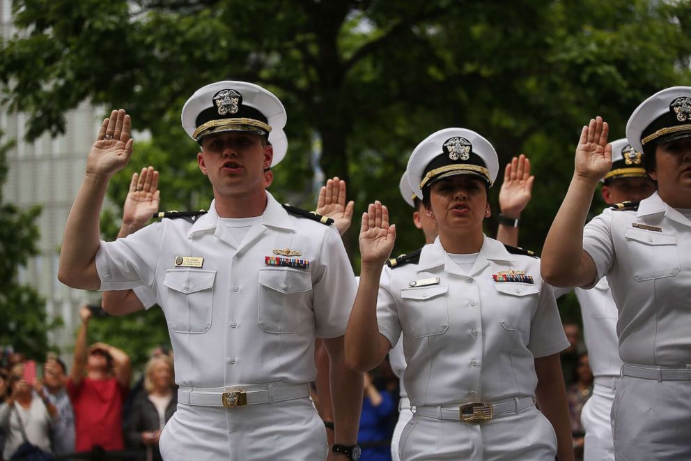 PHOTO: Members of the U.S. Navy and Coast Guard participate in a military re-enlistment and promotion ceremony outside of the 9-11 Memorial on May 26, 2017 in New York.