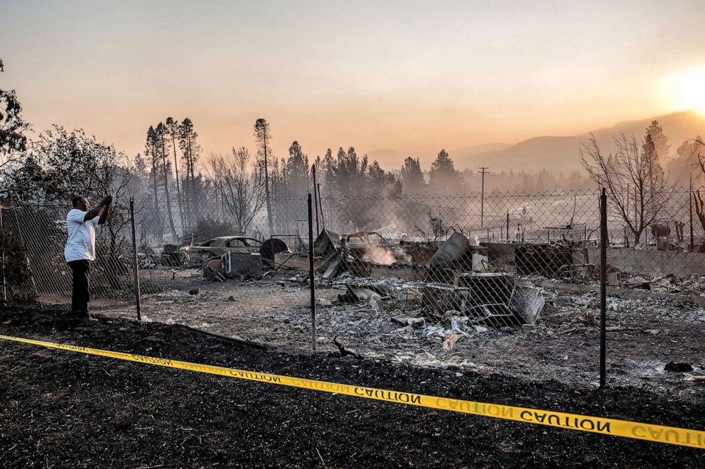 PHOTO: Dave Rodgers inspects his home, destroyed by the mill fire, Sept. 3, 2022, in Weed, California.