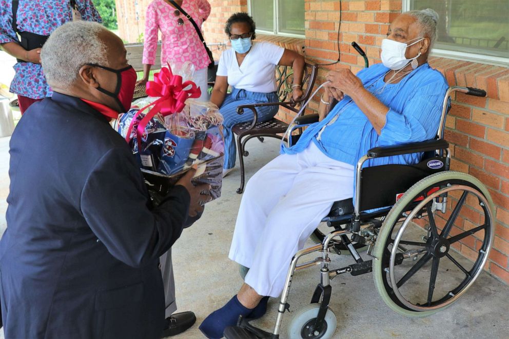 PHOTO: Catherine Miller celebrated her birthday on June 8 having survived a bout with COVID-19 last year. Miller, an alumna, was presented with South Carolina State University merchandise by James E. Clark, president of the university.