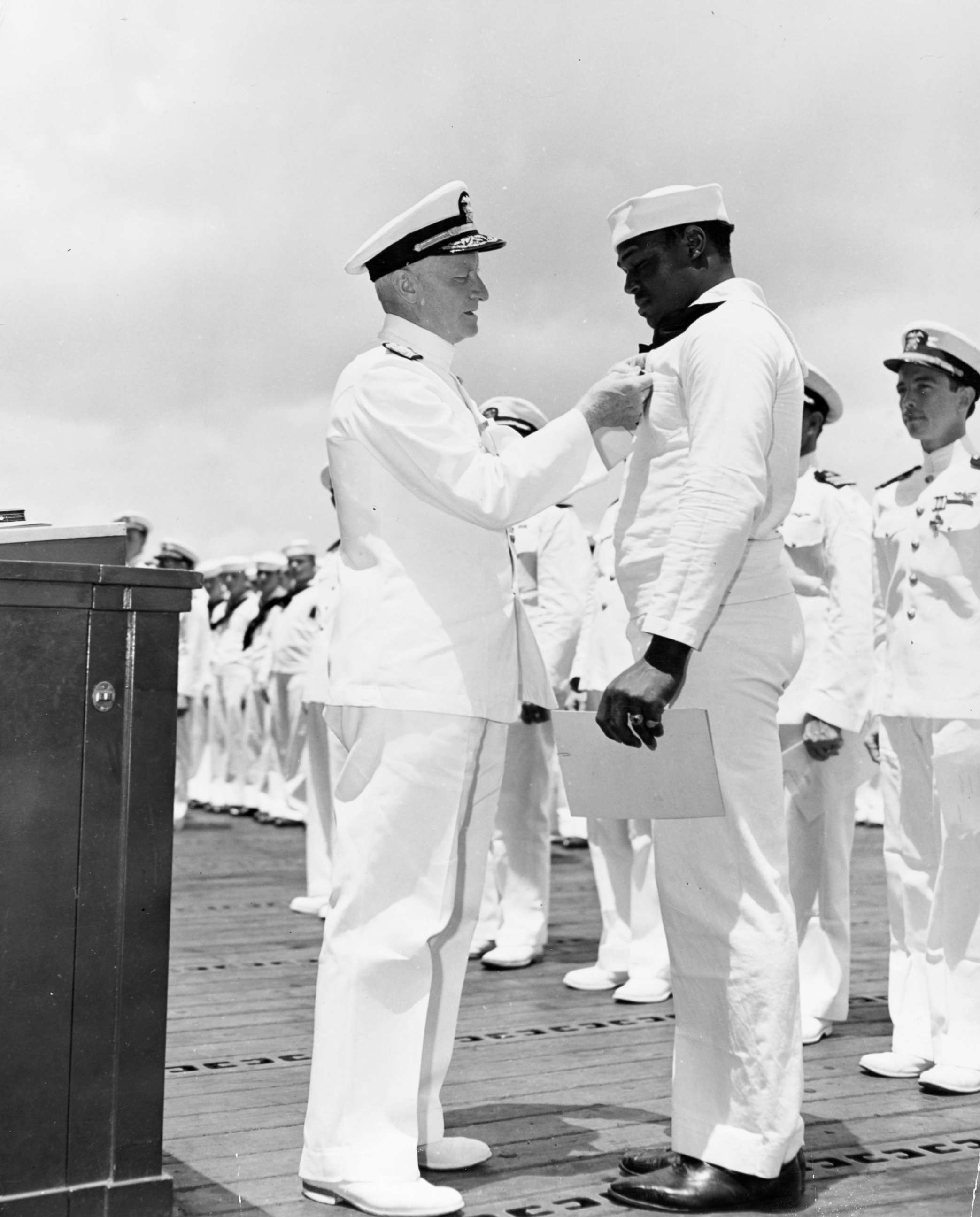 PHOTO: Adm. Chester Nimitz awards the Navy Cross medal to Mess Attendant 2nd Class Doris Miller for his actions aboard the battleship USS West Virginia (BB-48) during the Dec. 7, 1941 Japanese attack on Pearl Harbor.