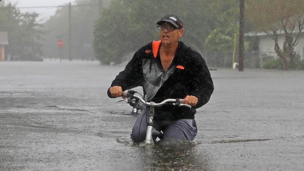 PHOTO: A resident on Magnolia Avenue surveys the flooding damage after Hurricane Milton passed in South Daytona, Fla., Oct. 11, 2024.