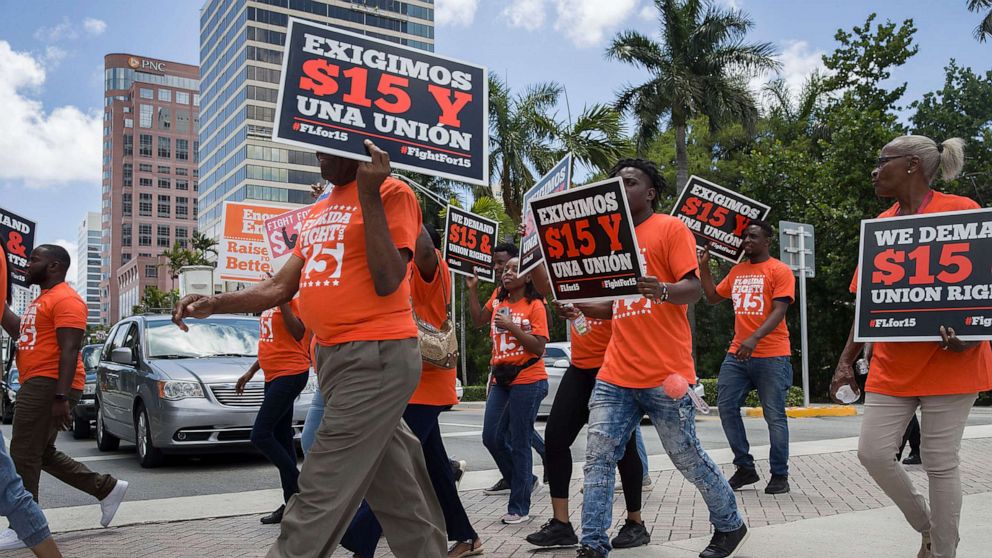 PHOTO: People march demand a raise in the minimum wage, May 23, 2019, in Fort Lauderdale, Fla.