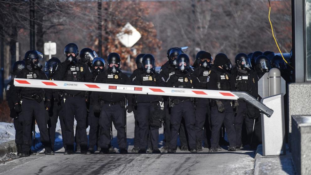PHOTO: Department of Homeland Security police officers block the entrance of the Bishop Whipple Federal Building while protesters oppose ICE detentions almost week after Alex Pretti was killed by ICE agents in Minneapolis, January 30, 2026. 