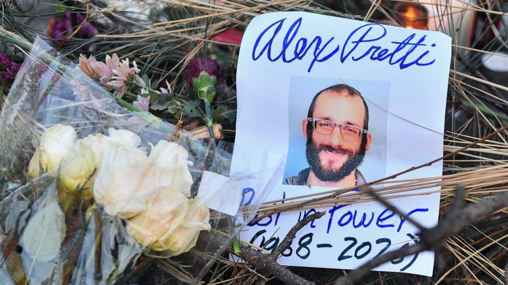 PHOTO: Flowers are left at a makeshift memorial in the area where Alex Pretti was shot dead a day earlier by federal immigration agents in Minneapolis, Minnesota, on January 25, 2026. 