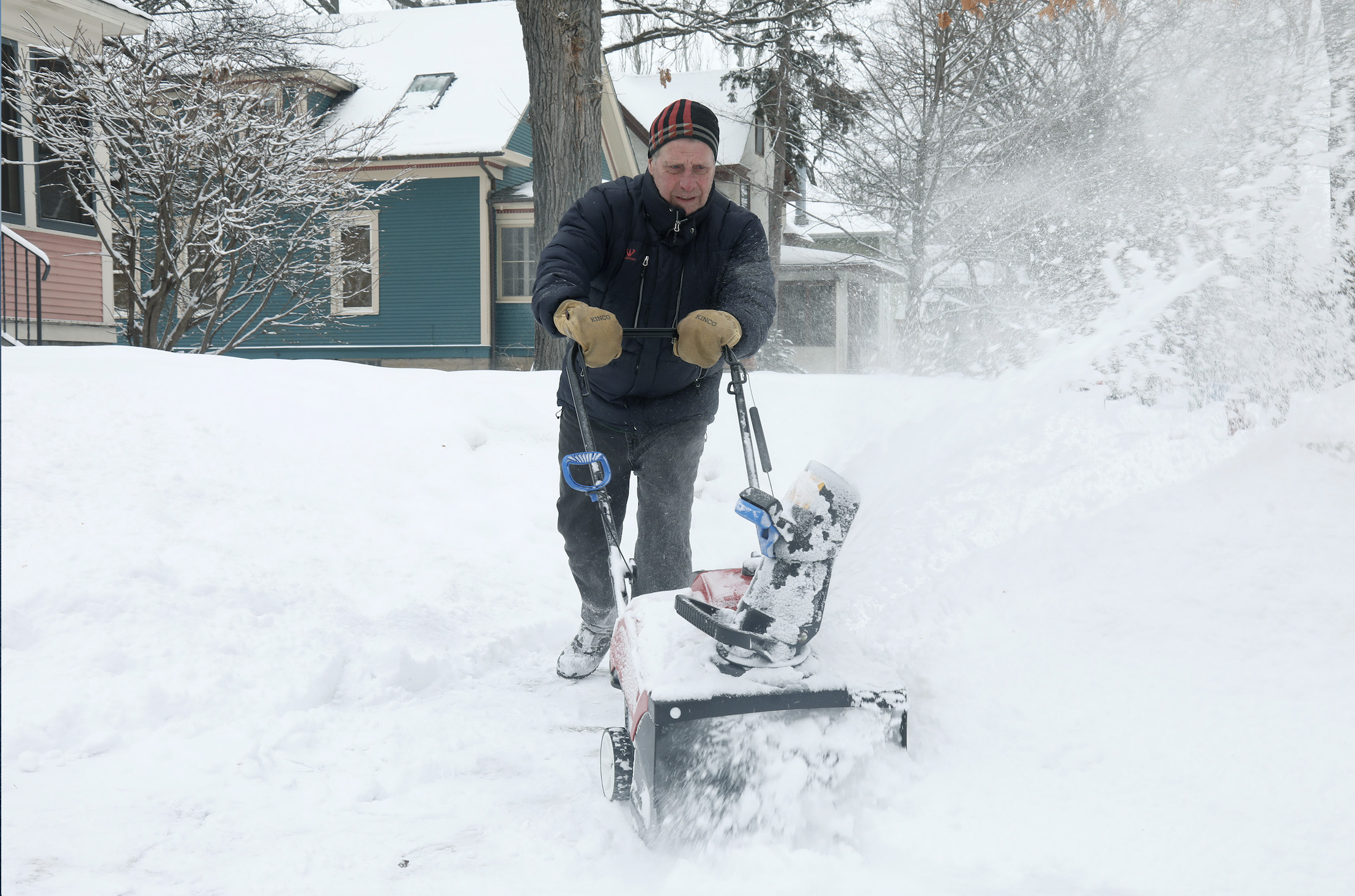 PHOTO: Bill Richardson uses a snow blower in Minneapolis, Feb. 4, 2021.