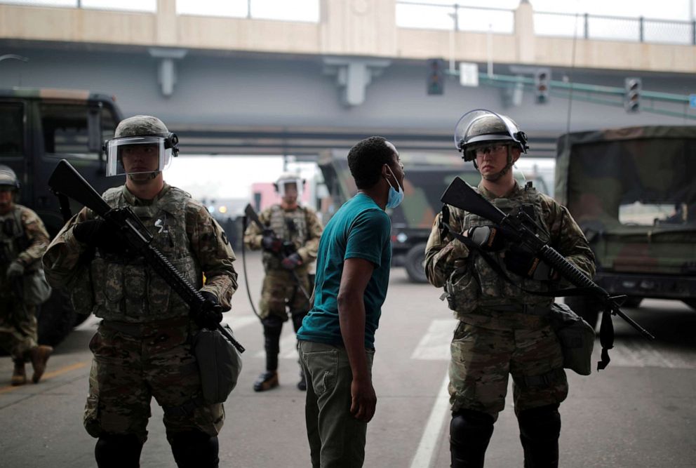 PHOTO: A man confronts a National Guard member as they guard the area in the aftermath of a protest against the death in Minneapolis police custody of African-American man George Floyd, in Minneapolis, Minnesota, May 29, 2020.