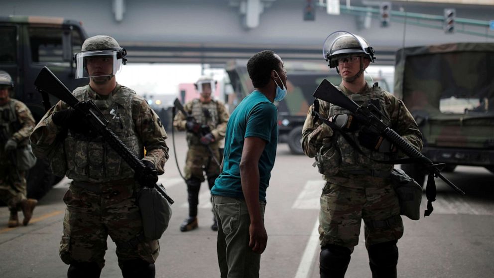 PHOTO: A man confronts a National Guard member as they guard the area in the aftermath of a protest against the death in Minneapolis police custody of African-American man George Floyd, in Minneapolis, Minnesota, May 29, 2020.