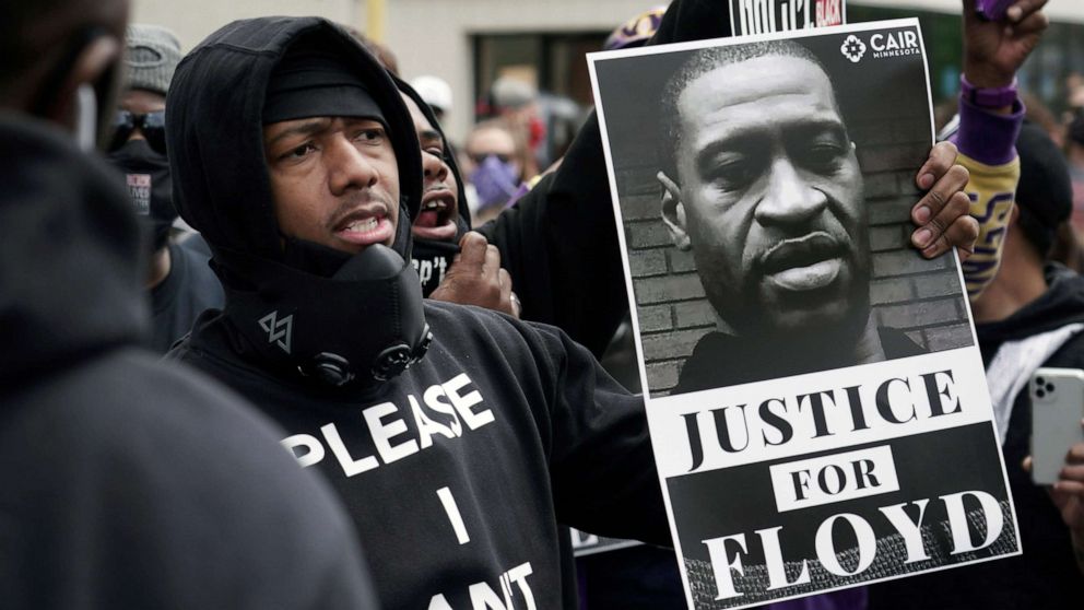PHOTO: Actor and comedian Nick Cannon celebrates the memory of George Floyd and demand justice outside the Cup Foods store on Chicago Avenue, Friday, May 29, 2020 in Minneapolis.
