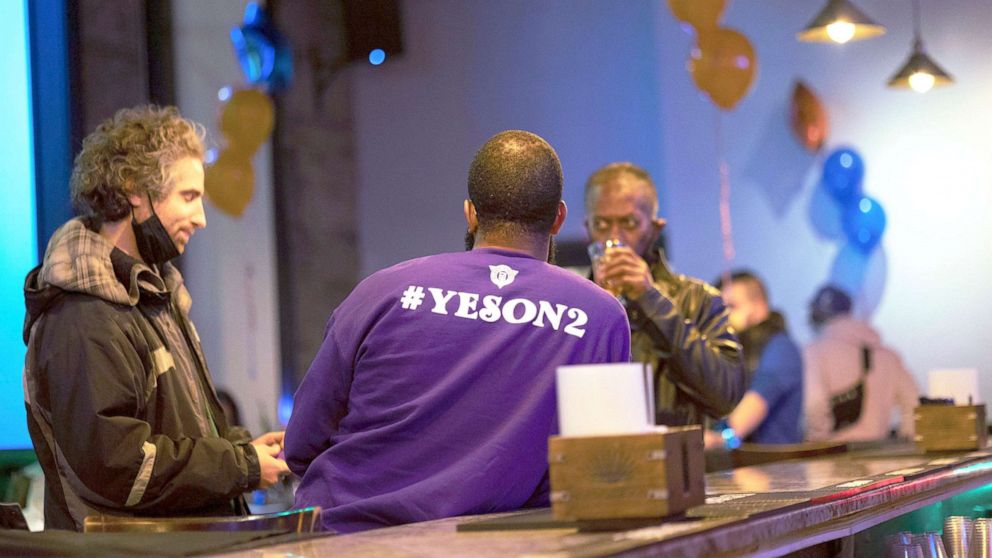 PHOTO: "Yes on 2" supporters watch as the results of the ballot question come in on Election Day during a watch party in Minneapolis, Nov. 2, 2021.