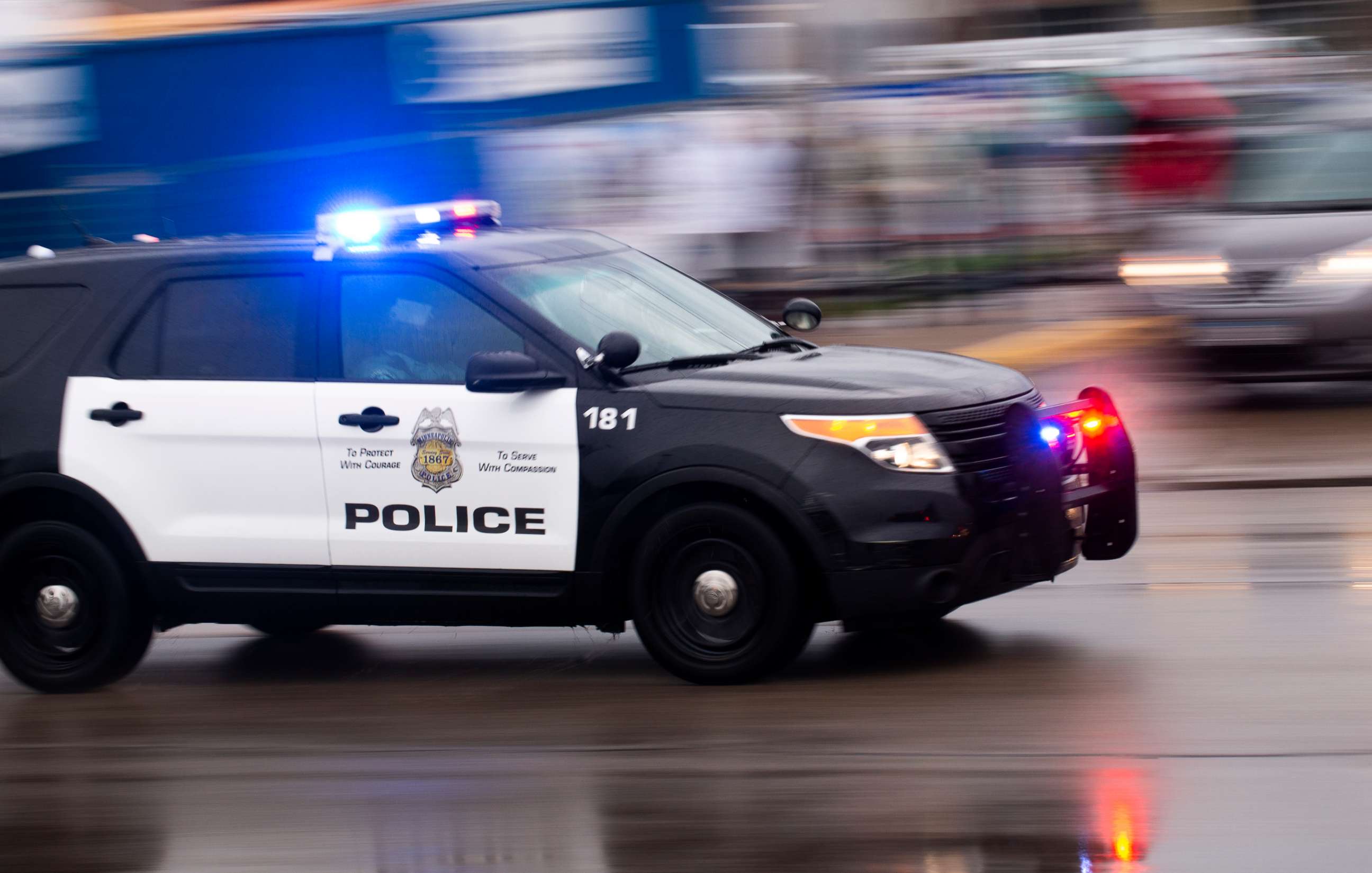 PHOTO: A police car drives by the 3rd Precinct Police Precinct on May 26, 2020, in Minneapolis.