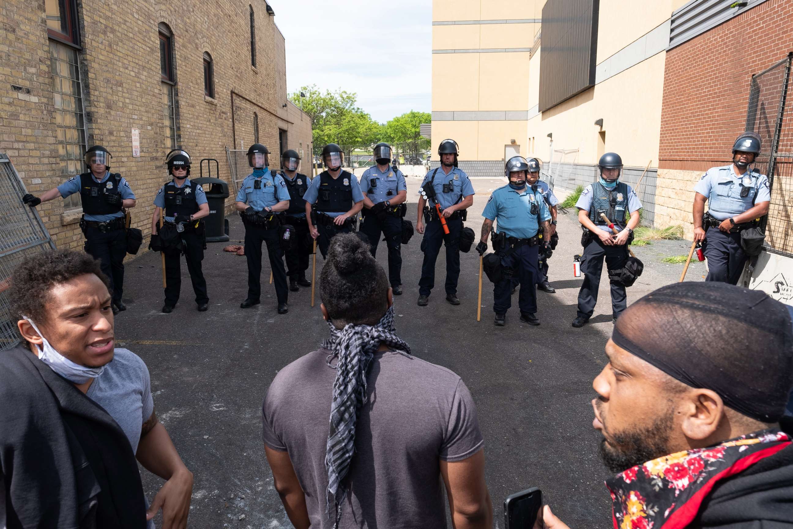 PHOTO: Protesters and police have a standoff behind the 3rd Precinct during a demonstration to call for justice for George Floyd, a black man who died while in police custody in Minneapolis, May 28, 2020.