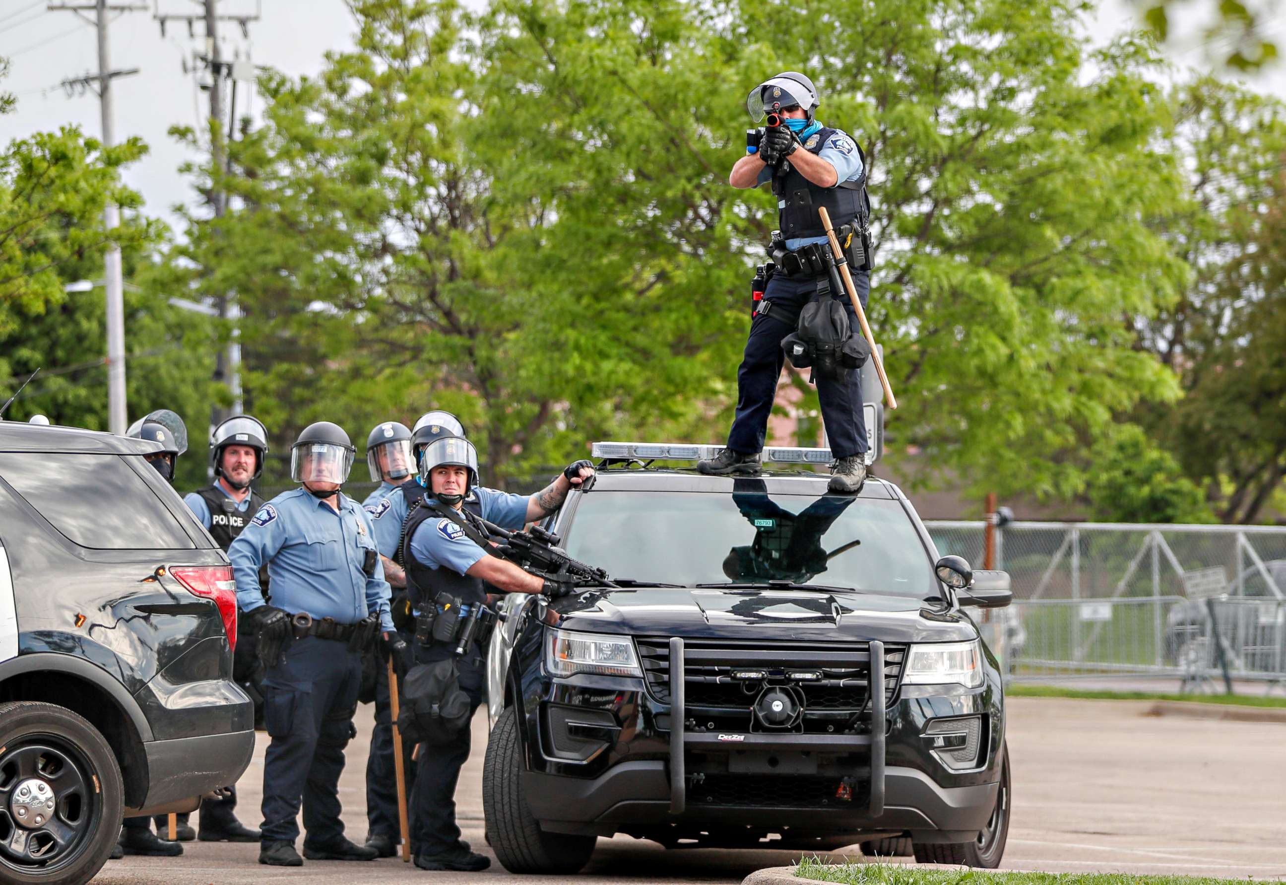 PHOTO: A police officer aims before firing at protestors gathered near the Minneapolis Police third precinct after the death of an African-American man, George Floyd, in Minneapolis, May 27, 2020.