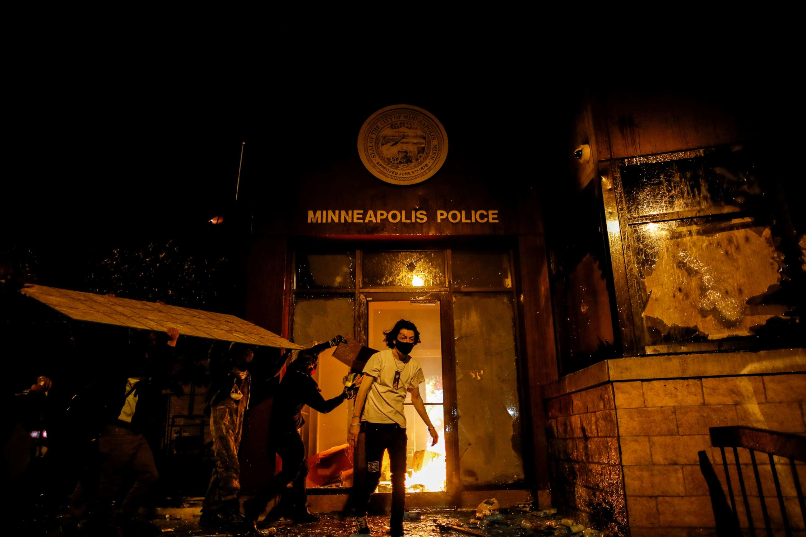 PHOTO: Protesters set fire to the entrance of a police station as demonstrations continue after a white police officer was caught on video pressing his knee into the neck of African American man George Floyd, who later died, in Minneapolis, May 28, 2020.