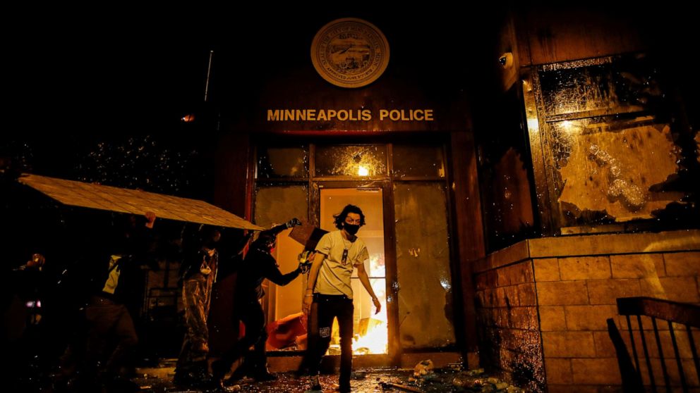 PHOTO: Protesters set fire to the entrance of a police station as demonstrations continue after a white police officer was caught on video pressing his knee into the neck of African American man George Floyd, who later died, in Minneapolis, May 28, 2020.