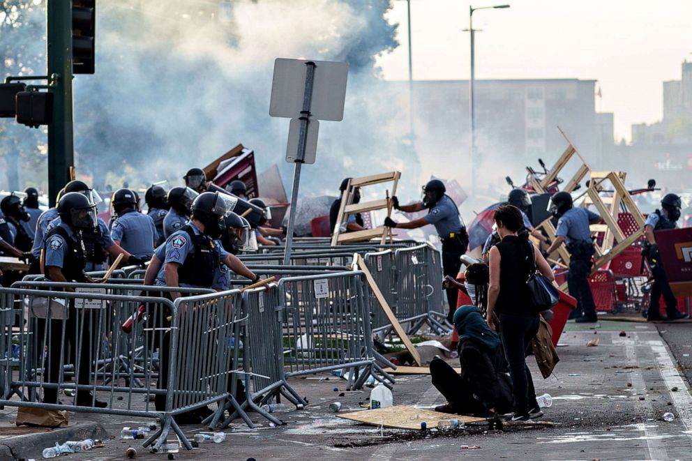 PHOTO: Police remove barricades set by protesters outside the Third Police Precinct over the death of George Floyd, May 27, 2020 in Minneapolis, Minn.