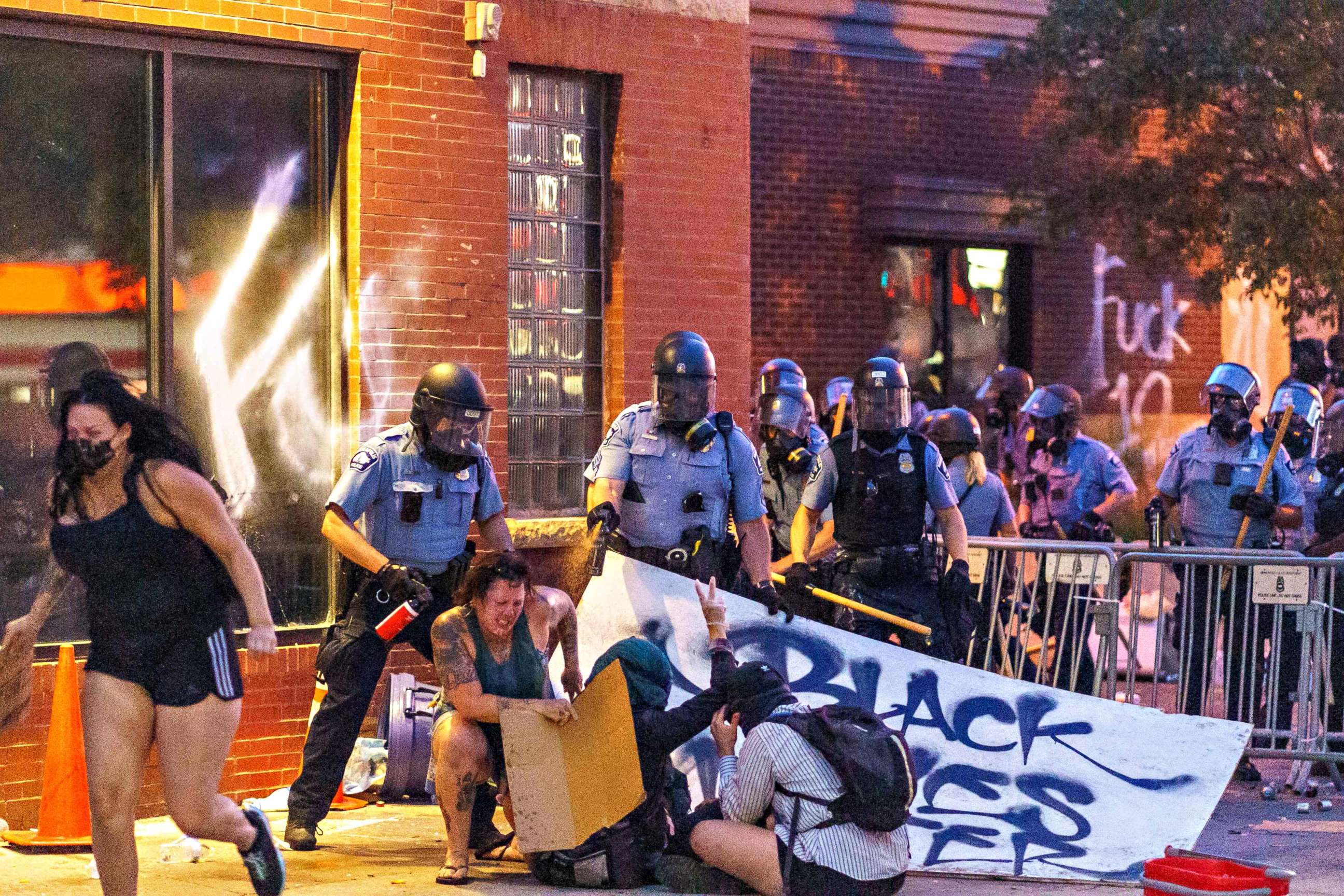 PHOTO: Police use pepper spray on protesters during a demonstration outside the Third Police Precinct over the death of George Floyd, May 27, 2020 in Minneapolis.
