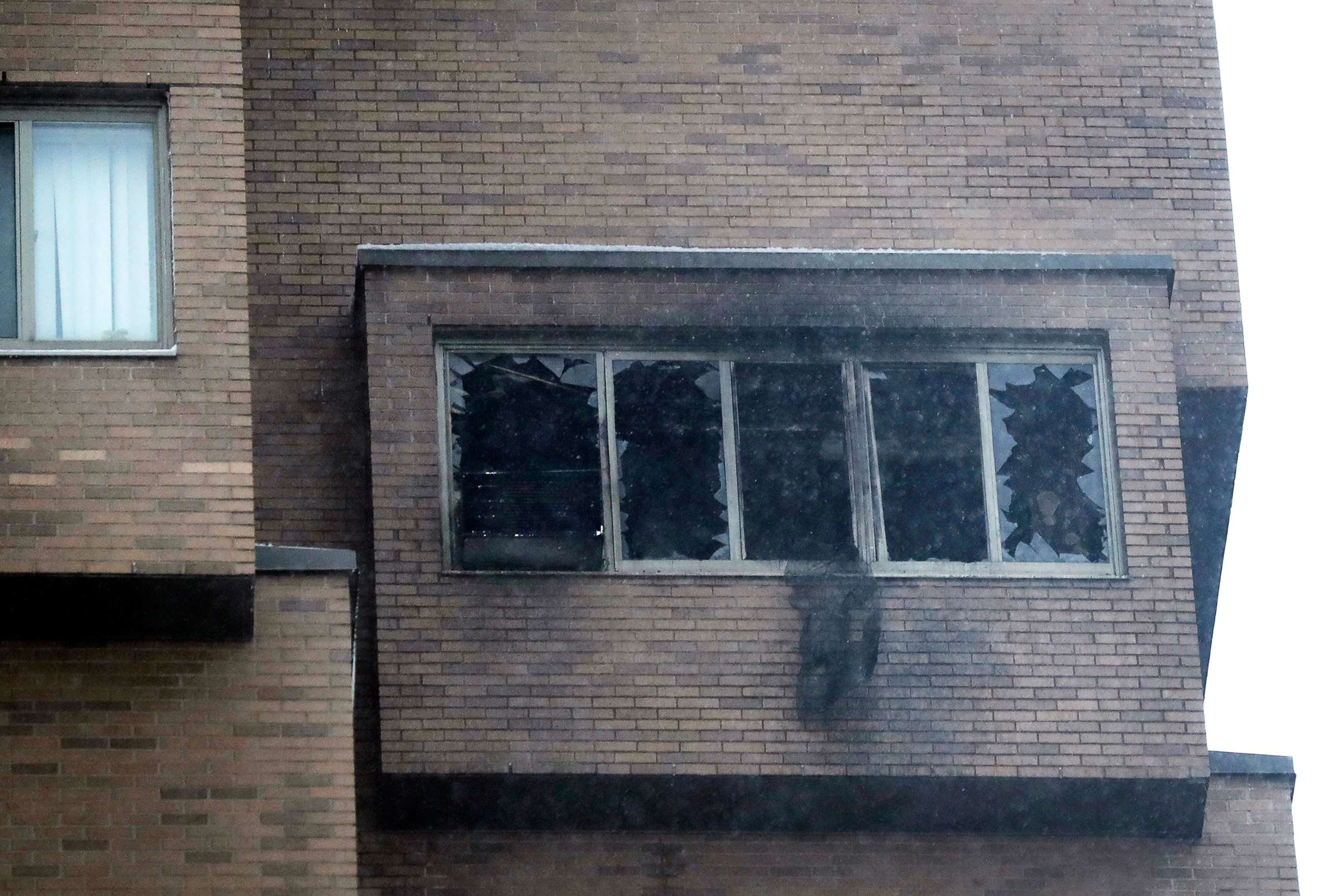 PHOTO: Broken windows and damage remain after a fire at the high-rise apartment building  Nov. 27, 2019, in Minneapolis.