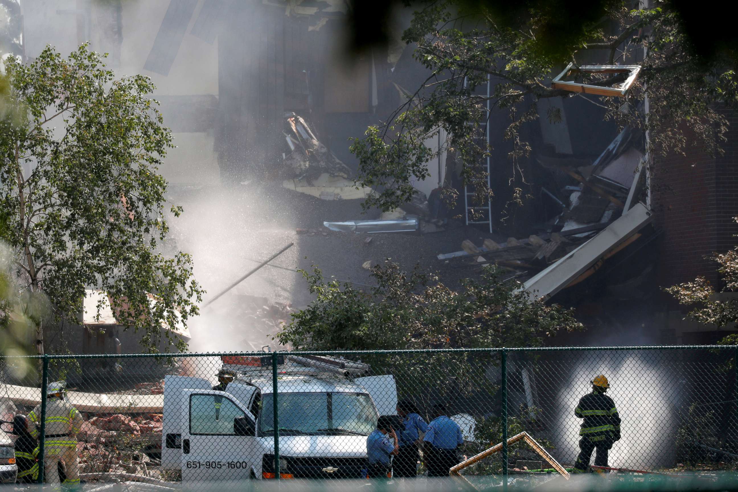PHOTO: Emergency personnel put water on the scene of school building explosion and collapse at Minnehaha Academy in Minneapolis, Minnesota, Aug. 2, 2017.