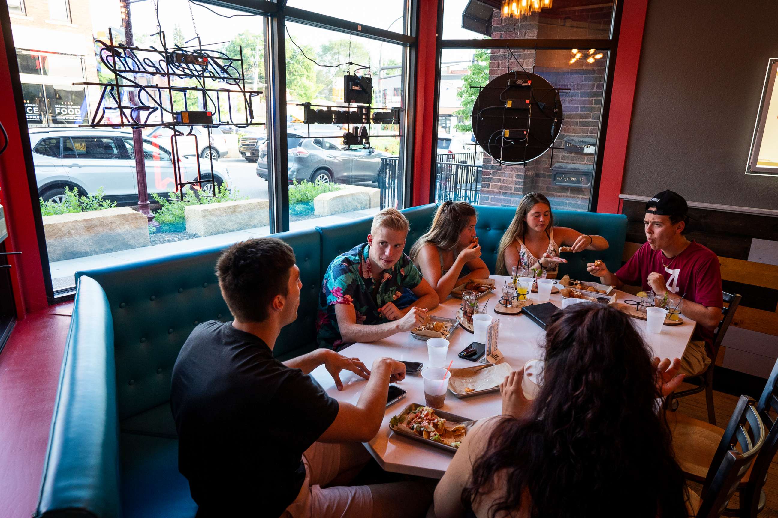 PHOTO: A group of Minnesota State University, Mankato students sit at The 507 in Mankato, Minn., July 8, 2020, during the coronavirus pandemic.