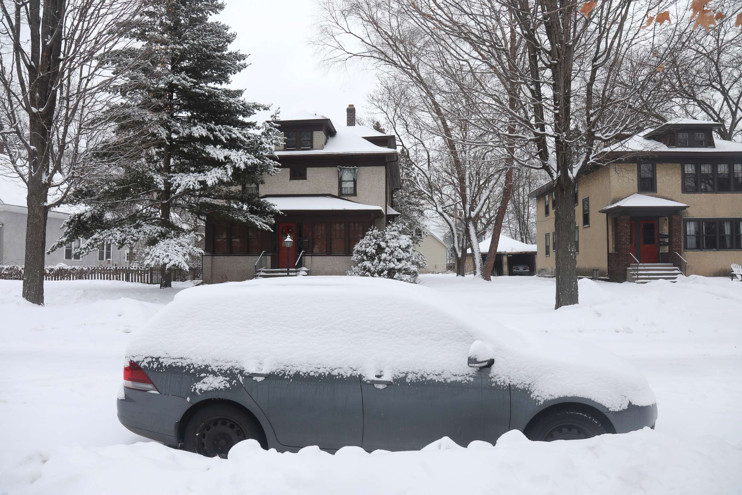 PHOTO: A car covered in snow is seen in Minneapolis, Feb. 4, 2021.