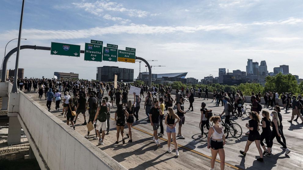 PHOTO: A crowd marches to protest the death of George Ford on the I-35W bridge over the Mississippi River, May 31, 2020 in Minneapolis, Minnesota.