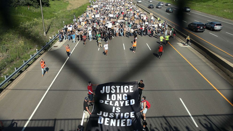 PHOTO: Demonstrators march on I- 35 while participating in a protest against police brutality and the death of George Floyd, May 31, 2020, in St. Paul, Minnesota.