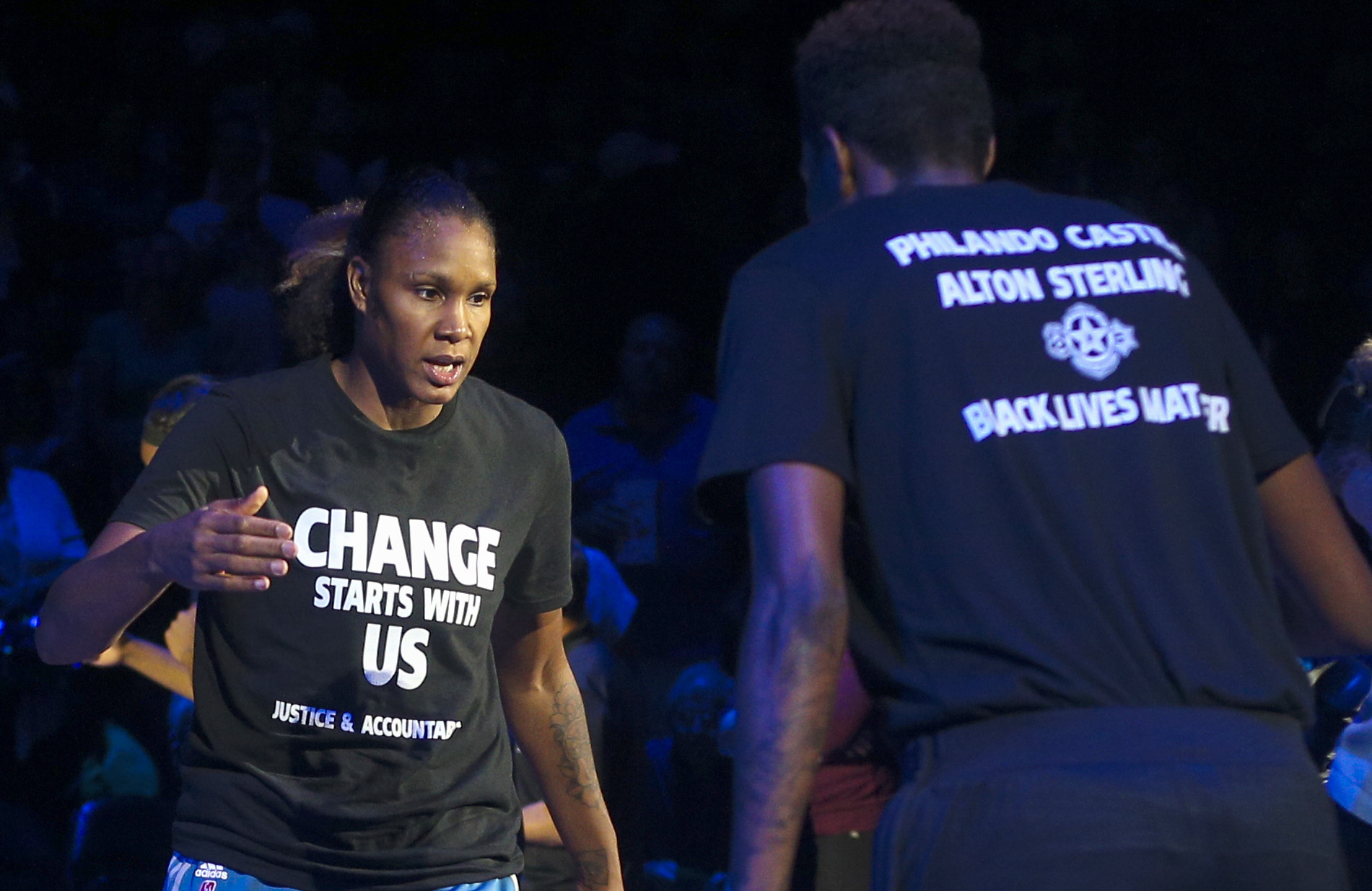 PHOTO: Minnesota Lynx forward Rebekkah Brunson (32) is greeted by Minnesota Lynx forward Natasha Howard (3) while starting lineups are announced at the Target Center, July 9, 2016.