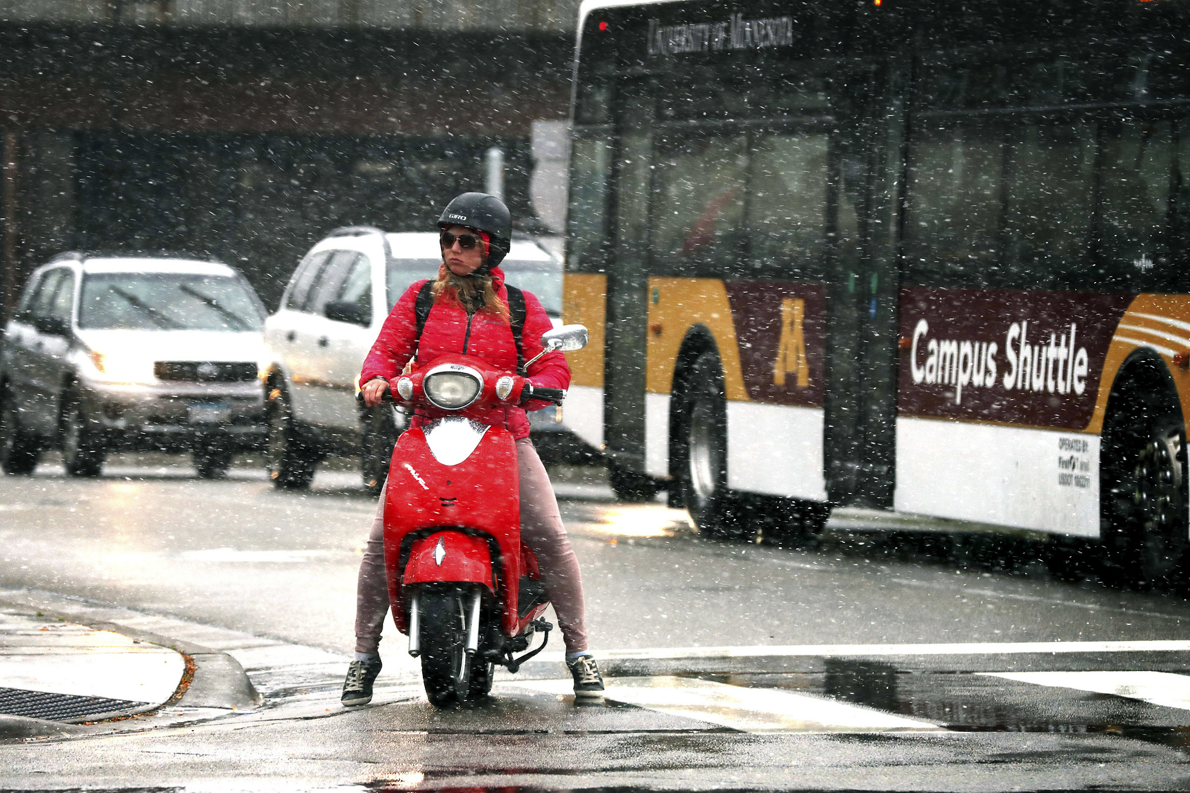 PHOTO: A commuter braves the first snow of the season on a scooter in the West Bank, in Minneapolis, Oct. 27, 2017. 