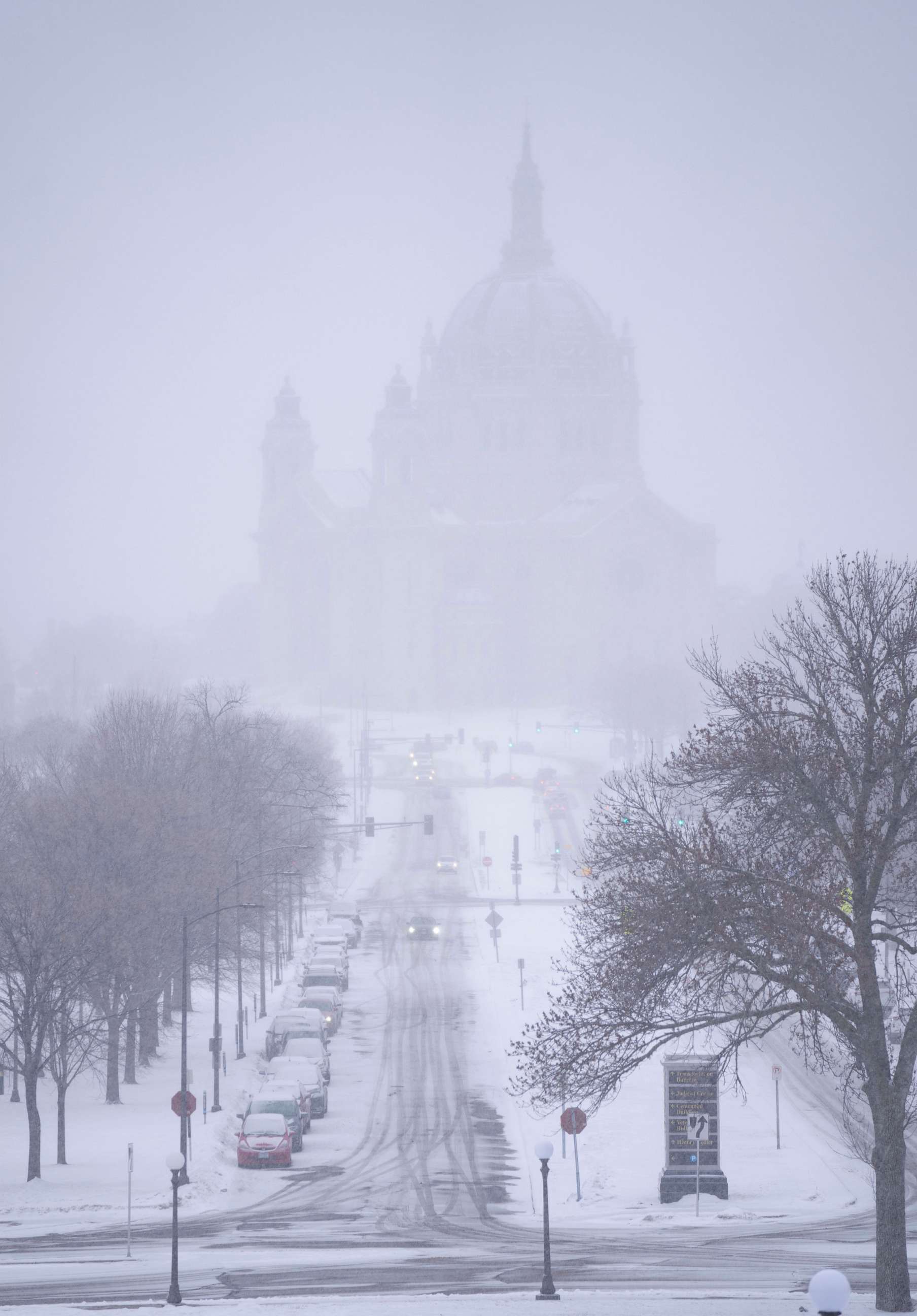 PHOTO: Snow begins to fall around the Cathedral of Saint Paul, Feb. 21, 2023, at the Minnesota State Capitol in St. Paul, Minn.