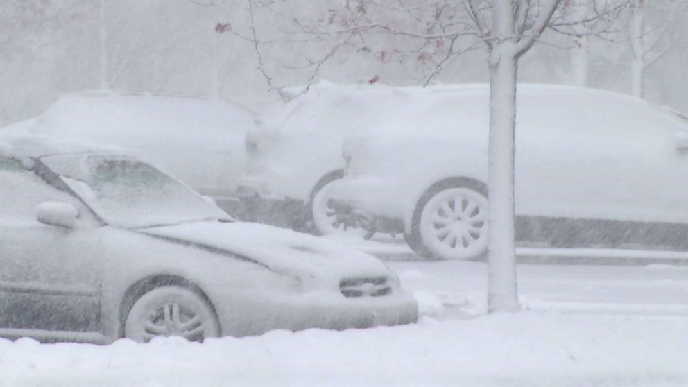 PHOTO: Parked cars are blanketed by early winter snowfall  which has killed 2 drivers, injured at least 25 and led to 161 vehicle spinouts.