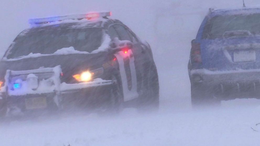 PHOTO: Police cruiser patrols through early winter weather that authorities confirms played a role to two fatal driver-related deaths, 25 injuries and over 161 spinouts.