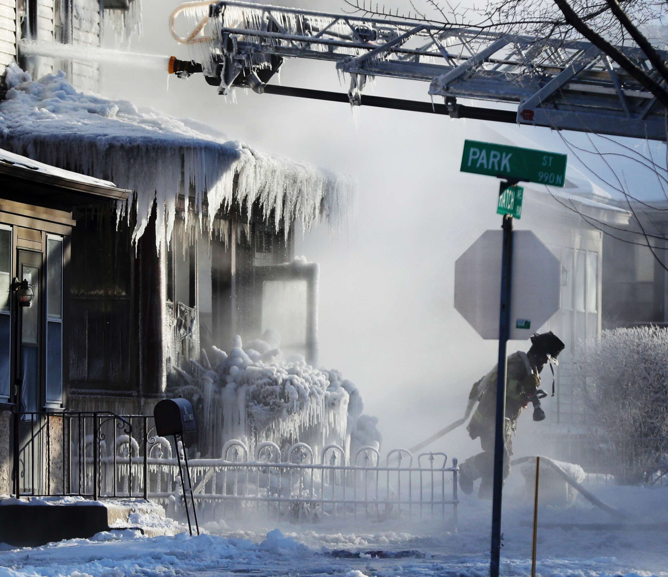 PHOTO: St. Paul firefighters at the scene of a house fire during a arctic deep freeze, Jan. 30, 2019, in St. Paul, Minn.